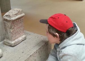 My son studying a Latin inscription in the Römisch-Germanisches Museum (Cologne)