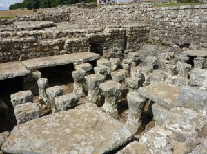 Roman heating arrangements at Housesteads Roman Fort. – Image source: http://media-cdn.tripadvisor.com/media/photo-s/04/63/70/eb/housesteads-fort-and.jpg.